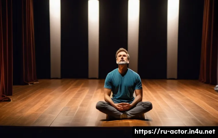 연극배우 자기계발 노하우 - A professional actor practicing diaphragmatic breathing in a dimly lit theater rehearsal room, sitti...
